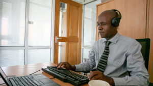A blind man using his computer