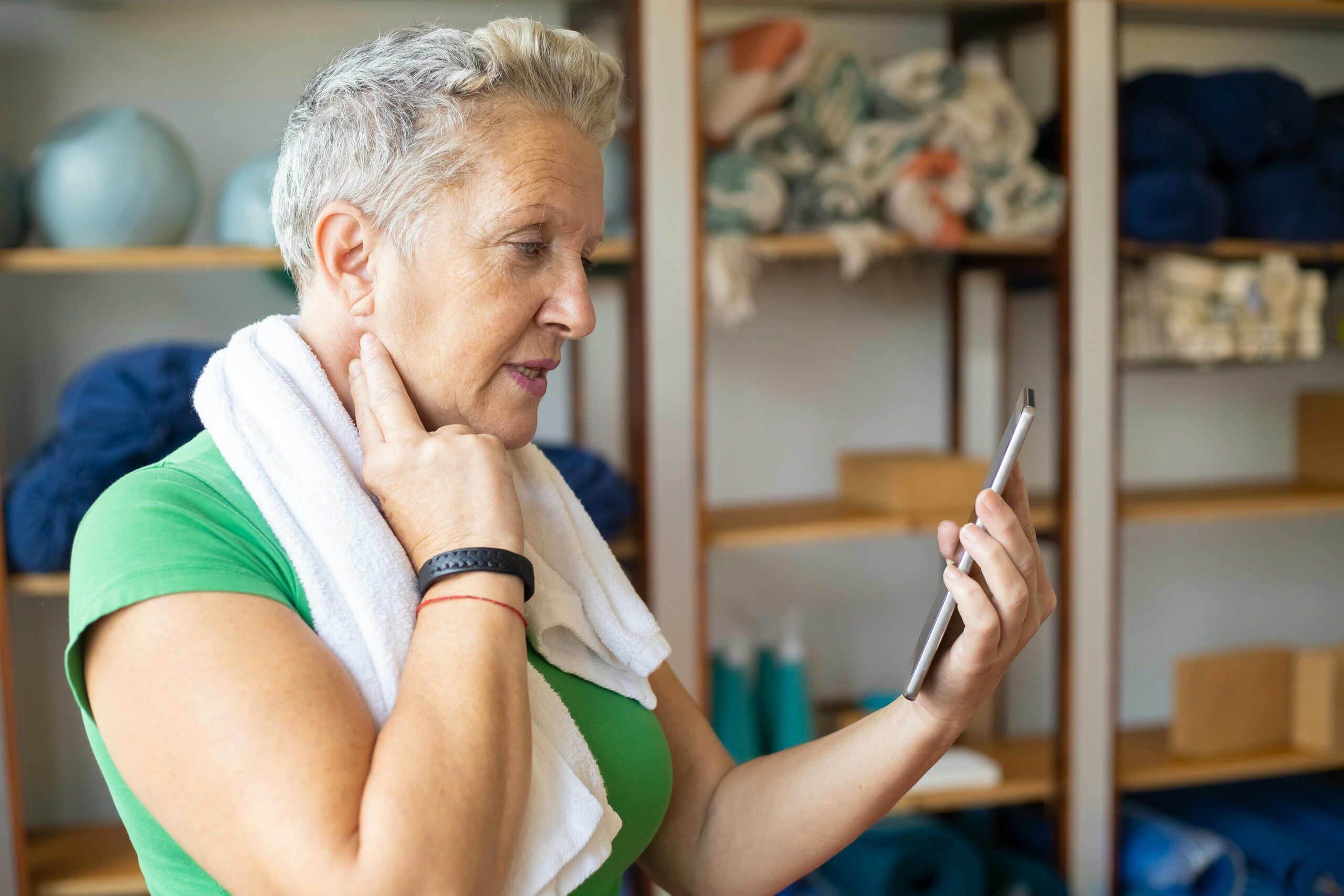 Landing Pages That Care: Creating Inclusive Health Campaigns Through Language and Design. Picture of a woman tracking her pulse after an excercise session.