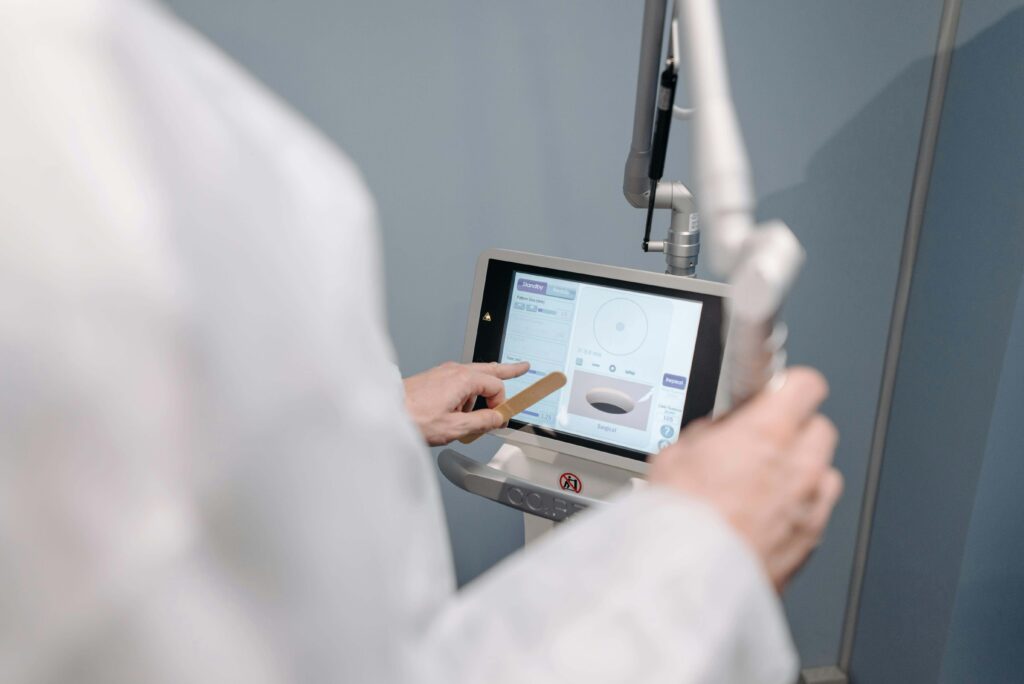 Close up to a doctor using a medical device