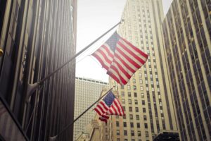 U.S. flags among downtown buildings.