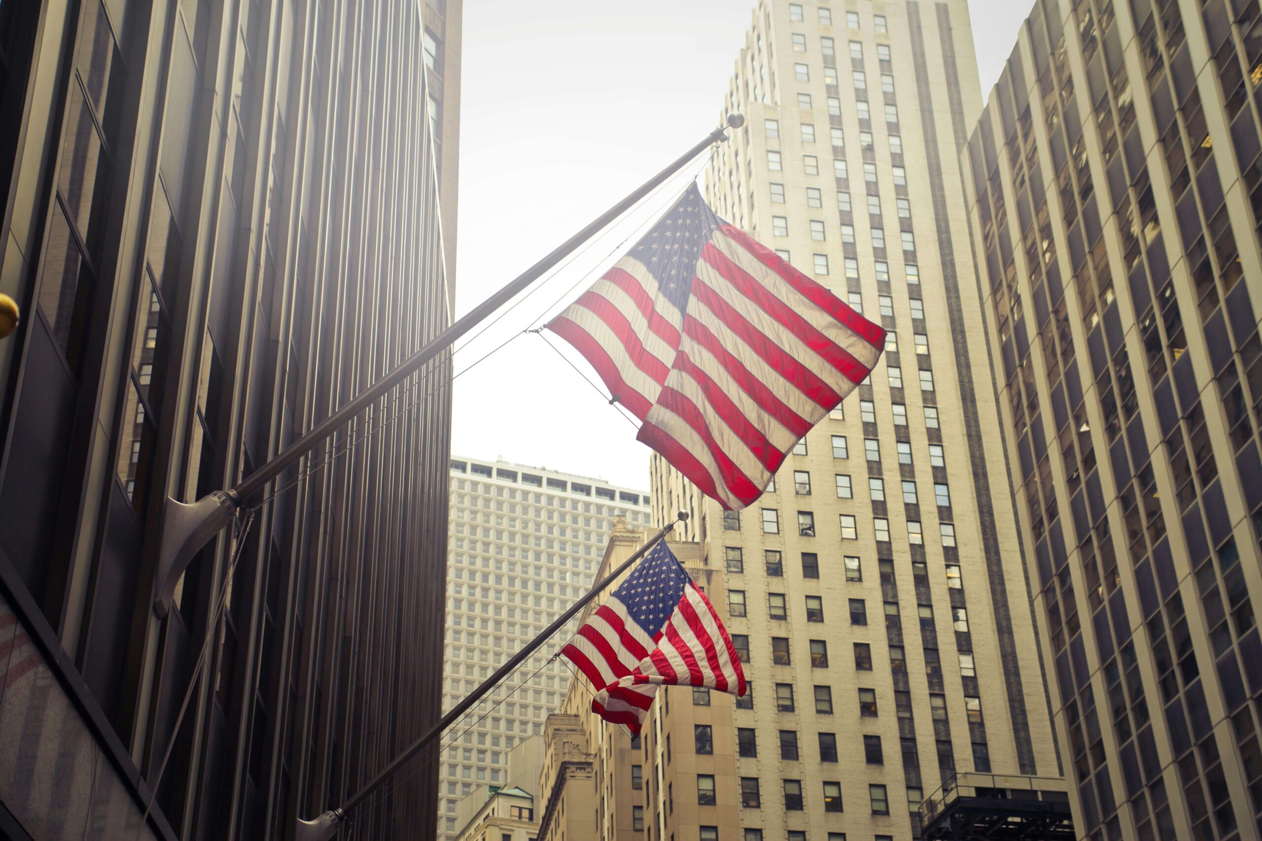 U.S. flags among downtown buildings.